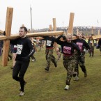 Competitors kick-off the event with a stint of cross-bearing at the start of the event in Perton, England. (AP Photo/Jon Super/PA Images)