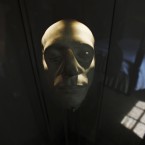 One of the original copies of the death mask of British poet John Keats taken in Rome a few days after his death in 1821, is photographed in a glass case in his bedroom at Keats House, in London. (AP Photo/Lefteris Pitarakis/PA Images)