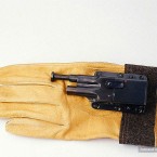 A small pistol with glove for convenient concealment. (Image via photoshtab.ru)