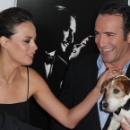 Uggie, Jean Dujardin and Berenice Bejo arrive at the AFI gala screening of