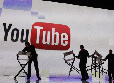Stage crew workers prepare the set for a keynote speech by YouTube at the 2012 International Consumer Electronics Show, Thursday, Jan. 12, 2012, in Las Vegas. 