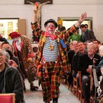 Clowns in full costume commemorate their hero. (Yui Mok/PA Images)