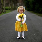 Kacey Gray, aged 3, holds a bunch of daffodils in St Stephen's Green, Dublin to celebrate the 25th birthday of the Irish Cancer Society's Daffodil Day. Image: Julien Behal/PA Wire