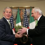 Taoiseach Bertie Ahern seems to have surprise President George W Bush with this bowl of shamrocks in the Roosevelt Room of the White House on St Patrick's Day in 2006. (AP Photo/Charles Dharapak/PA Images)