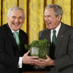 Bush and Bertie have gotten into the swing of things by their third shamrock exchange on St Patrick's Day, 2008. (AP Photo/Gerald Herbert, PA File)
