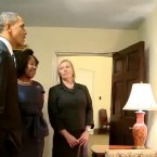 President Obama looks at Norman Rockwell painting that is hanging on the wall outside of the Oval Office. (Via YouTube/whitehouse)  