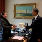 Picture of Statue of Liberty in background as President Barack Obama surprises personal secretary Katie Johnson with a birthday gift in the Outer Oval Office in 2010. (Official White House Photo by Pete Souza)

