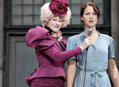 Effie Trinket (played by Elizabeth Banks) and Katniss Everdeen (Jennifer Lawrence) in The Hunger Games