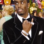 Sean Combs showing off his 'bling' at the Academy Awards in 2005. (AP Photo/Chris Pizzello)