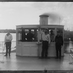 On the deckhouse of the steamboat Sheksna of the MPS, 1909. The photographer with two men, Murman, 1915. (Library of Congress, Prints & Photographs Division)