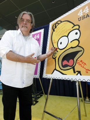 Matt Groening signs a Homer Simpson stamp in 2009. 