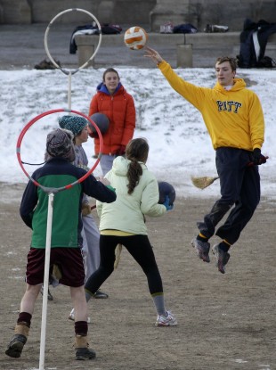 University of Pittsburgh student Andrew Bulman, right, of Bryn Mawr, Pa., leaps to make a pass during a Quidditch match in Pittsburgh 2012.