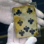 A seven of clubs card, one of the things recovered from the wreckage of the RMS Titanic. (AP Photo/Stanley Leary)