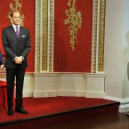 The new wax figures of the Duke and Duchess of Cambridge with Prince William's mother Diana and brother Harry close by, go on display at Madame Tussauds in London. (John Stillwell/AP Images)
