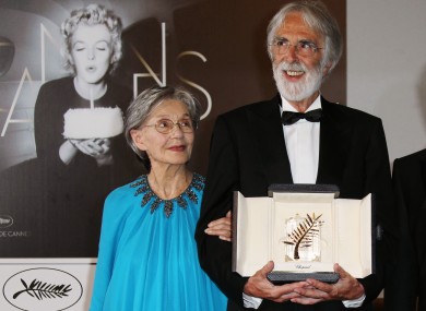 Michael Haneke, right, poses for photographers with the Palme d'Or award for Love alongside Emmanuelle Riva 