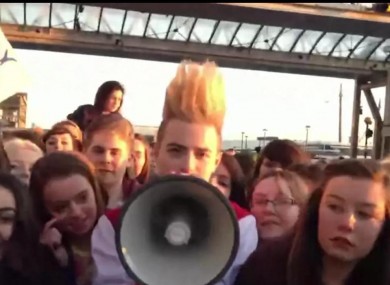 John or Edward Grimes at Dublin Airport with a megaphone this morning. 