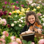 Violinist Marciana Buta performs amid roses by David Austin. (Dominic Lipinski/PA Wire)