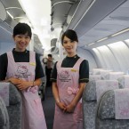 Flight attendants pose on board. (Photo by ChinaFotoPress/PA)