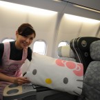 A flight attendant shows the Hello Kitty soft furnishings on board. (Photo by ChinaFotoPress/PA)