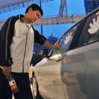 Qiu Jianjun indulges in a special type of athletic endeavour - he competed for five years for the right to use a BMW 1 Series car in Chengdu, Sichuan, China. He had to keep a hands on the stickers and had only a 15-minute break every four hours. (CDSB/ChinaFotoPress/PA Wire)