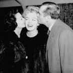 Hollywood's Marilyn Monroe gets farewell kisses on both cheeks from actor Sir Laurence Olivier and his actress wife Vivien Leigh at London airport. Miss Monroe was about to board a Pan American liner with her husband, American playwright Arthur Miller, to fly back to the United States after making her first British film 'The Sleeping Prince' with Sir Laurence at Pinewood Studios. (AP Photo)