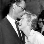 Actress Marilyn Monroe leans against her fiance, playwright Arthur Miller, in her apartment house in New York, June 22, 1956. (AP Photo)