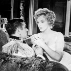 Sir Laurence Olivier and American actress Marilyn Monroe in a scene from their film 'The Prince and the Showgirl' which was produced and directed by Sir Laurence Olivier. (AP PHOTO)