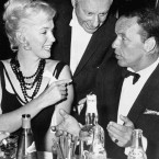 Marilyn Monroe talks to Frank Sinatra during a party on the set of the musical. (Press Association Images)