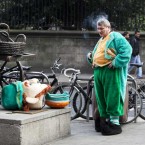A well-deserved break for the man behind the mask, as the famous Leprechaun who stands beside Dublin's Molly Malone statue has a cigarette. (Leon Farrell/Photocall Ireland)