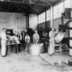 Metal workers making engine cowlings which smoothed airflow over the engine to reduce drag, increasing speed and fuel efficiency. (NASA Archives)