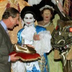 Unless they are dipped in gold, as this pair appear to be, avoid the pair of slippers trap which might infer that you think he's getting on... Pic: PA Photos/Reuters Rota Pic.