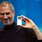Steve Jobs, shown here displaying the iPod mini in 2004, was given a posthumous Grammy for creating