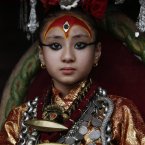 Nepal's living goddess locally known as Kumari, Samita Bajracharya, watches the last day of Rato Machhendranath chariot festival in Patan, outskirts of Katmandu, Nepal. (AP Photo/Binod Joshi)