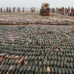 This steam roller crushed bottles of alcohol during a ceremony to mark International Day against Drug Abuse and Illicit Trafficking, on the outskirts of Karachi, Pakistan. (AP Photo/Shakil Adil)