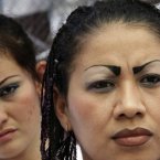 Female inmates attend a religious service marking one hundred days since a peace agreement was reached among gang members at the women's prison of Ilopango in San Salvador, El Salvador. (AP Photo/Luis Romero)