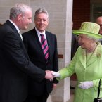 Queen Elizabeth II shakes hands with Northern Ireland Deputy First Minister Martin McGuinness watched by First minister Peter Robinson (centre) at the Lyric Theatre in Belfast. (Paul Faith/PA Wire)