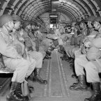 American paratroopers sit in a military plane as they soar over the English Channel en route to Normandy for the invasion on 6, June 1944. (AP Photo)