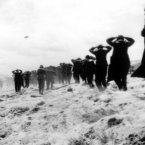 German prisoners of war are led away by Allied forces from Utah Beach on 6 June, 1944. (AP Photo)