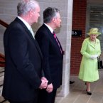 Queen Elizabeth II arrives to meet Northern Ireland First Minister Peter Robinson (centre) and Deputy First Minister Martin McGuinness (left) at the Lyric Theatre in Belfast. (Paul Faith/Photocall Ireland/PA Images)