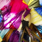 Technician Stephen Dodd hangs up artist Angela Fulcher piece entitled