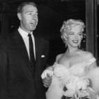 With Joe DiMaggio (her second of three husbands), as she arrives at the theatre on 2 June 1955. (AP Photo, File)