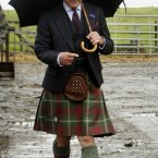 'So that's where my hat went. Now I'm stuck using this umbrella which does nothing for my outfit.' (Danny Lawson/PA Wire)