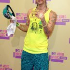 Living up to his name, Riff Raff opted for beach hobo-chic. Keep an eye out for new lines of couture hand towels, they'll be storming the catwalks this season. (Image:Doug Peters/EMPICS Entertainment)