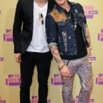 We can only assume Nash Overstreet had to rush straight to the awards after painting rainbows with the Care Bears and didn't have time to change his trousers. (Image: Doug Peters/EMPICS Entertainment)