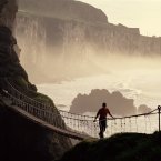Carrick-a-Rede Rope Bridge is a rope suspension bridge near Ballintoy, Co Antrim. The bridge links the mainland to the tiny Carrick Island. Image: Chris Hill/Tourism Ireland.