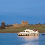 Cruising by Clonmacnoise near Shannonbridge, Co Offaly, the early Christian site founded by St Ciarán in the mid-6th century on the eastern bank of the River Shannon. Image: Holger Leue/Tourism Ireland.