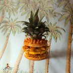 Roasted pineapple wedges, sirloin pork caramelised in pineapple juices and spices, melted cheddar, top of a pineapple.