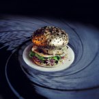 Gold tinfoil-wrapped buns, quail eggs, letuce, creme fraiche, mini-octopi.