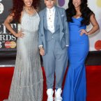 We love the middle one in Stooshe's style, including the nod to the greatest moment in Brits history via her footwear (Spice Girls, obvs.). Doug Peters/Doug Peters/EMPICS Entertainment