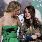 TAYLOR SWIFT AND EMMA STONE:  What the?  What?!?  We're as surprised as you are.  Taylor even introduced Harry Styles to the person she says is 